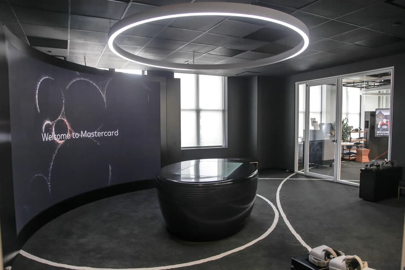 The curved welcome screen and ring light at the Mastercard Experience Centre in St Leonards, Sydney